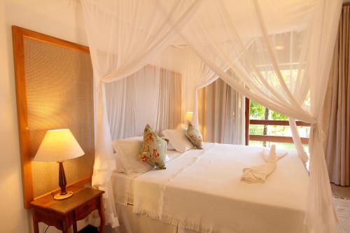 Giường trong phòng chung tại Porto Seguro Praia Resort - All Inclusive