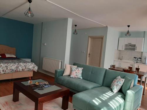 a living room with a couch and a coffee table at Samlife Apart in Samsun