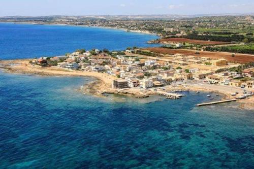 an aerial view of a small island in the water at Casa malacala in Calabernardo