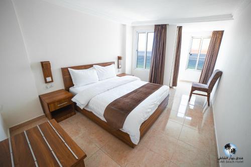 Katil atau katil-katil dalam bilik di Joar Beach Hotel