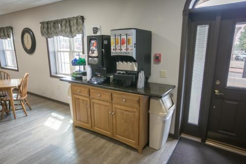 a kitchen with a counter with a coffee maker at Lodging on the Square in Berlin