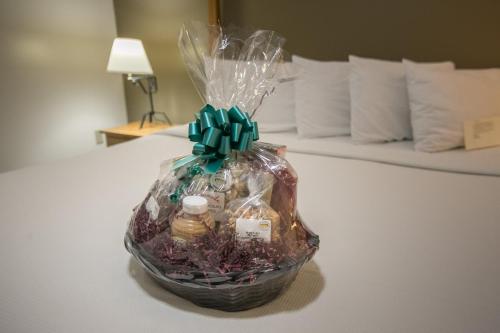 a basket filled with groceries sitting on a bed at Lodging on the Square in Berlin