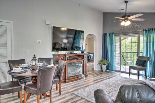 a dining room and living room with a table and chairs at Family Resort Condo with Perks in Branson! in Branson