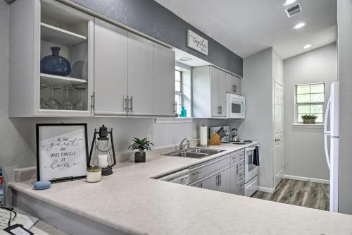 a kitchen with white cabinets and a counter top at Family Resort Condo with Perks in Branson! in Branson