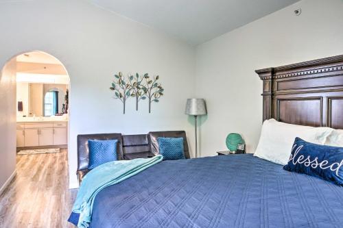 a bedroom with a large blue bed with blue pillows at Family Resort Condo with Perks in Branson! in Branson