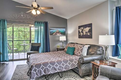 a bedroom with a bed and a couch at Pristine Holiday Hills Resort Condo in Branson! in Branson