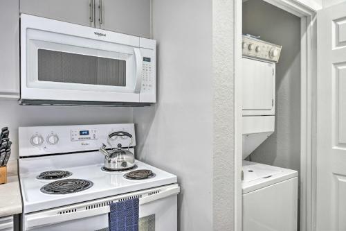 a kitchen with a stove and a microwave at Family Resort Condo with Perks in Branson! in Branson