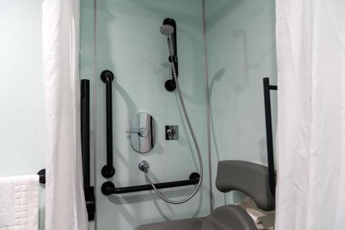 a shower stall in a bathroom with a shower at easyHotel Sheffield in Sheffield