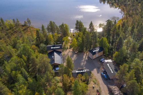 an aerial view of a house in the woods at Mökki - The White Blue Wilderness Lodge in Inari