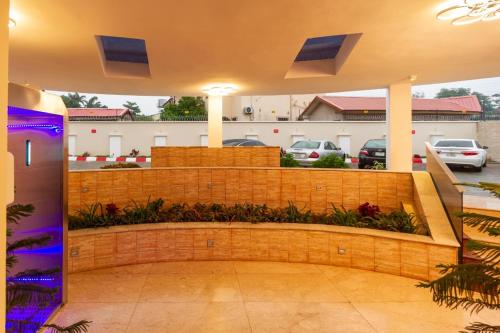 a bench in the middle of a parking lot at Hera in Wuse