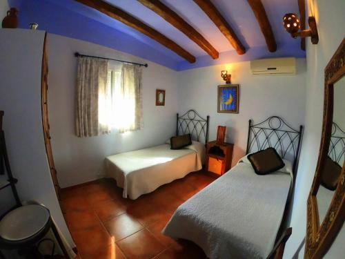 Posteľ alebo postele v izbe v ubytovaní Casa La Araucaria