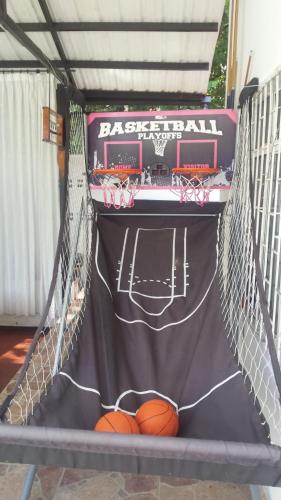 a basketball hoop with two balls in it at Casa Quinta Santana in Melgar