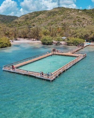 a dock in the middle of a body of water at Casa Bonita Inn in La Parguera