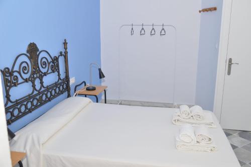 Letto o letti in una camera di Pensión Las Cuatro Naciones