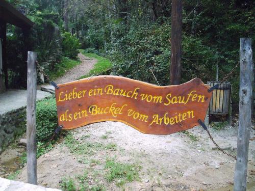 a sign that reads elder an bucket worn samurai san istg istg istg istg istg istg at Cabañas Am Hang in La Cumbrecita