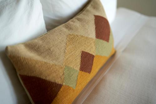 a close up of a pillow on a bed at Hotel Magdalena in Austin