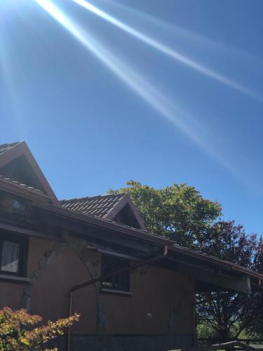 a roof of a house with trees in the background at Hotel Pietrapanna in Calvello
