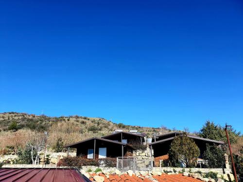 a house on the side of a mountain at Agriturismo Leanza "La Baita" in Cesarò