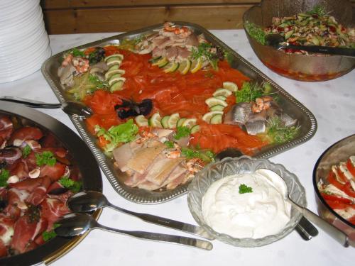 a table topped with trays of food on a table at Gasthof zum Lamm in Gomadingen