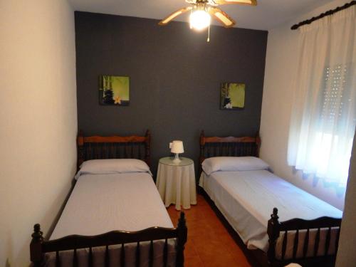Ένα ή περισσότερα κρεβάτια σε δωμάτιο στο Villa María - Pista de Padel y Piscina
