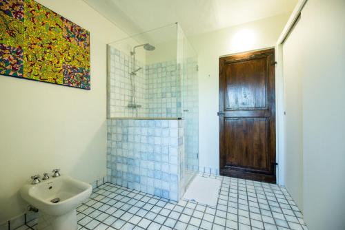 a bathroom with a sink and a shower and a toilet at Casa Silvana in Alba