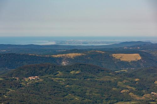 an aerial view of a mountain range with a body of water at Holiday country house Gora in Gozd