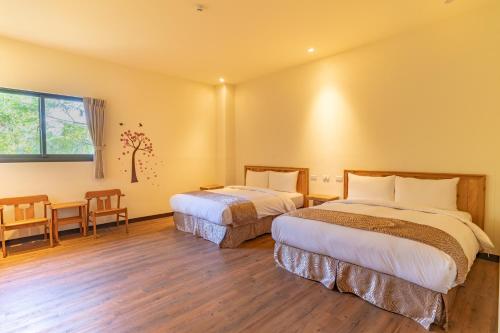 Cama o camas de una habitación en Lane 523埔里包棟庭園民宿