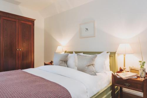 A bed or beds in a room at Craigellachie Hotel of Speyside 