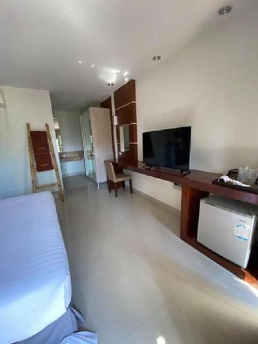 TV a/nebo společenská místnost v ubytování Sunset Beach Villas