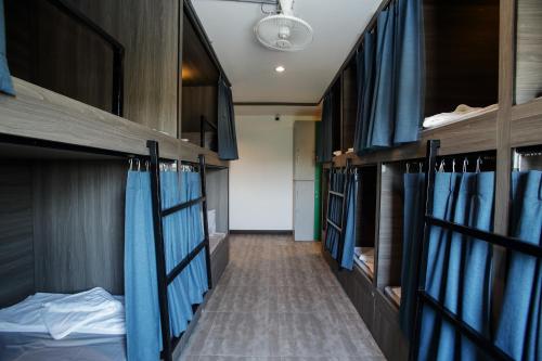 Postel nebo postele na pokoji v ubytování จ้าวหอม บูทิก โฮเทล