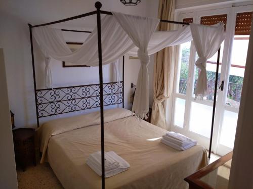 Ένα ή περισσότερα κρεβάτια σε δωμάτιο στο Tenuta Belvedere