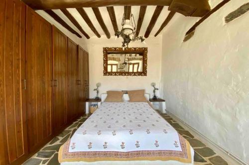 En eller flere senge i et værelse på The Old Stone Cottage