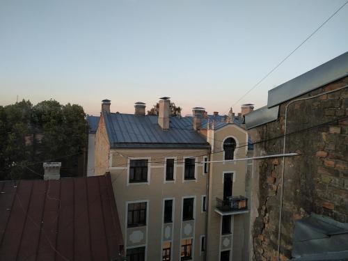 a view of a building with a roof at Sunlit Loft Apartment Riga in Rīga