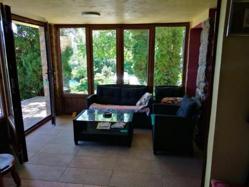 a living room with a couch and a coffee table at Beautiful holiday house in Sremska Kamenica