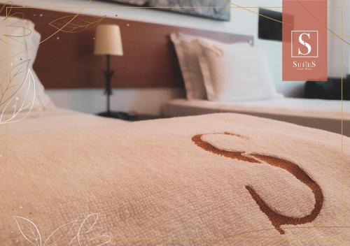 a close up of a bed in a bedroom at Yellow Suites in Cascais