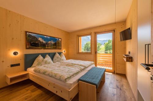 En eller flere senge i et værelse på Residence Bergheim