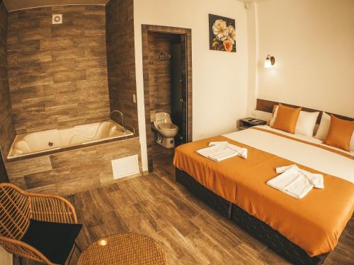 Postel nebo postele na pokoji v ubytování Toucan Platinum Suites Aparthotel