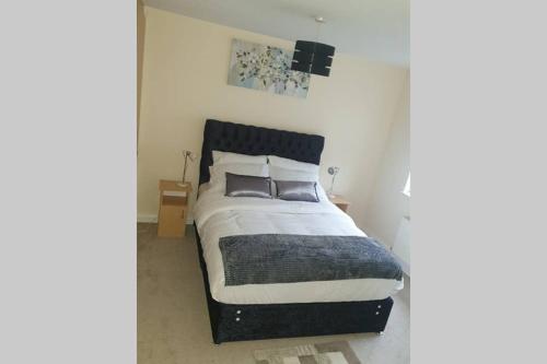 a bedroom with a bed with two pillows on it at private-ensuite-room Limerick city stay in Limerick