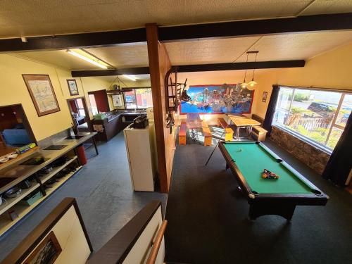 an overhead view of a living room with a pool table at Chateau Backpackers & Motels in Franz Josef