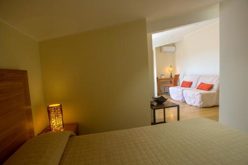 Postel nebo postele na pokoji v ubytování Hotel Cesario