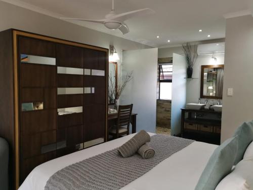 Ένα ή περισσότερα κρεβάτια σε δωμάτιο στο St Lucia Hilltop Guest House