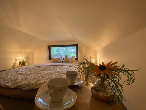 a bedroom with a large bed with a window at Siedlisko Odpoczynkowo in Nowosiółki
