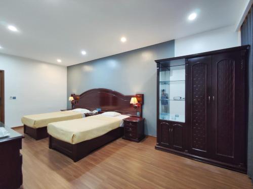 Posteľ alebo postele v izbe v ubytovaní Gieng Ngoc Hotel