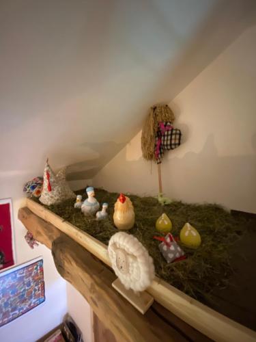 a shelf with a bunch of rubber ducks on it at Siedlisko Odpoczynkowo in Nowosiółki