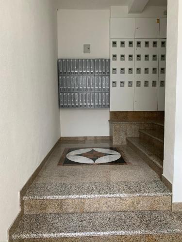a room with stairs with a picture on the floor at Sea&Center Lux in Bar