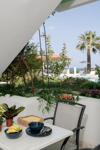 a table with two bowls of food on a patio at Villa Life in Agia Marina Nea Kydonias