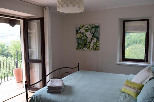 Postel nebo postele na pokoji v ubytování Casa Langhe di Mango - Barolo