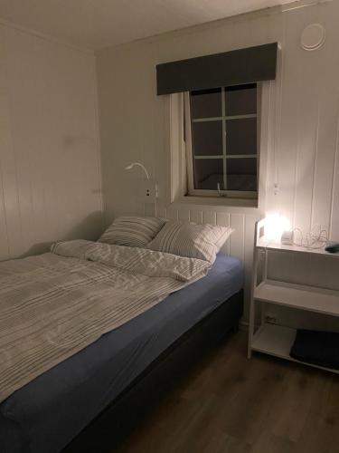 Postel nebo postele na pokoji v ubytování Rorbu i Lofoten