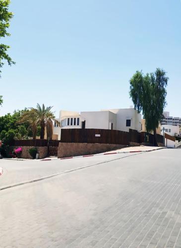 an empty street in front of a building at Guest House "Villa Klara Eilat" Heated pool and sauna all year round in Eilat