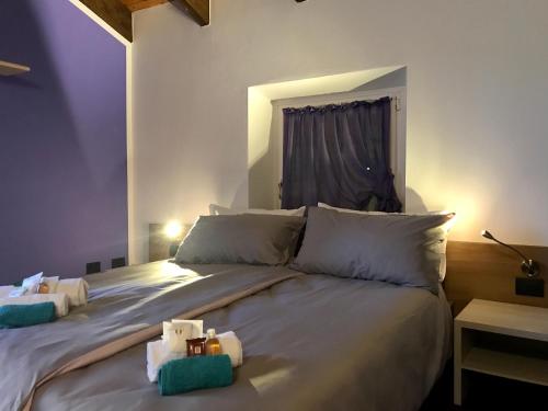 Postel nebo postele na pokoji v ubytování Al Chiar di Luna B&B Valtellina